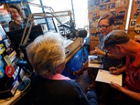 Former DJ's Gloria Clark, left, and Chris Connors, right along with station director, Jennifer Mulcare-Sullivan conduct an on air show for the final time.  The University of Massachusetts Dartmouth radio station, WUMD, stopped broadcasting over the airwaves after 42 continuous years.   It will now continue to broadcast strictly over the internet at www.umd.rocks   [ PETER PEREIRA/THE STANDARD-TIMES/SCMG ]